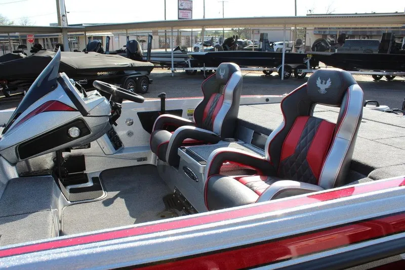 Slide: The Image of Interior of 2026 Phoenix 921 Elite X boat with stylish seating and modern dashboard. - 16