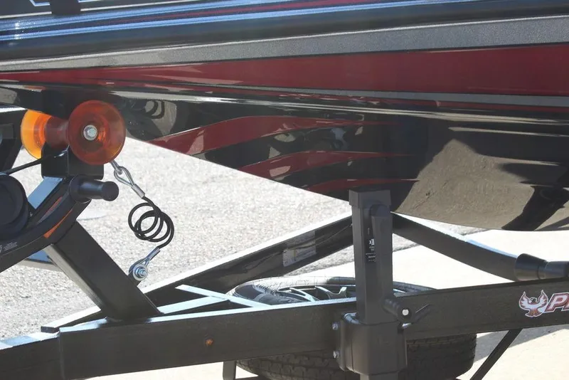 Slide: The Image of Trailer detail of 2026 Phoenix 921 Elite X boat with red and black accents. - 17