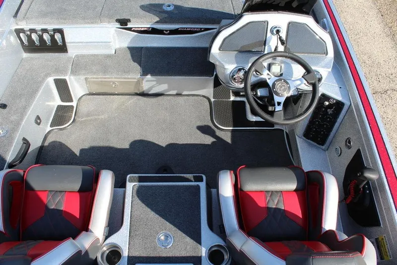 Slide: The Image of Interior of 2026 Phoenix 921 Elite X boat with steering wheel and seating. - 18