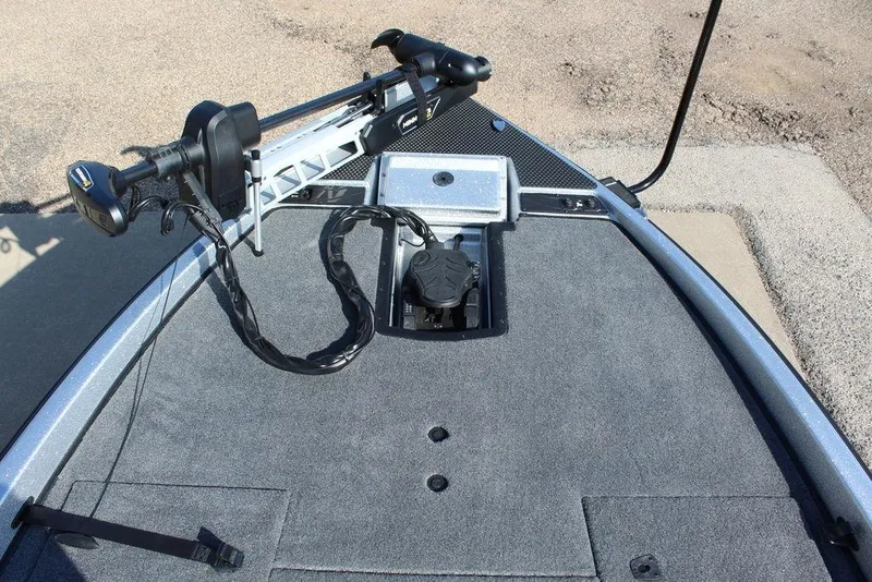 Slide: The Image of Bow of 2026 Phoenix 921 Elite X boat with trolling motor and carpeted deck. - 19