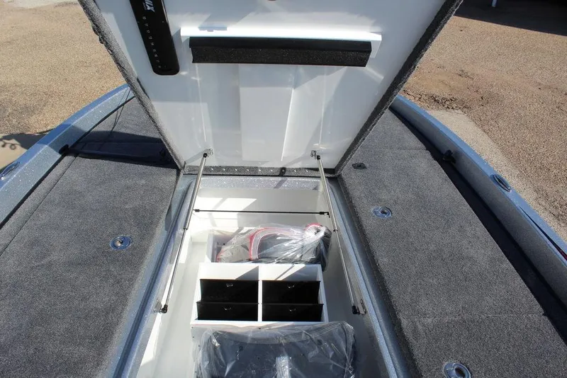 Slide: The Image of Open storage compartment in 2026 Phoenix 921 Elite X boat, showcasing organized interior space. - 20