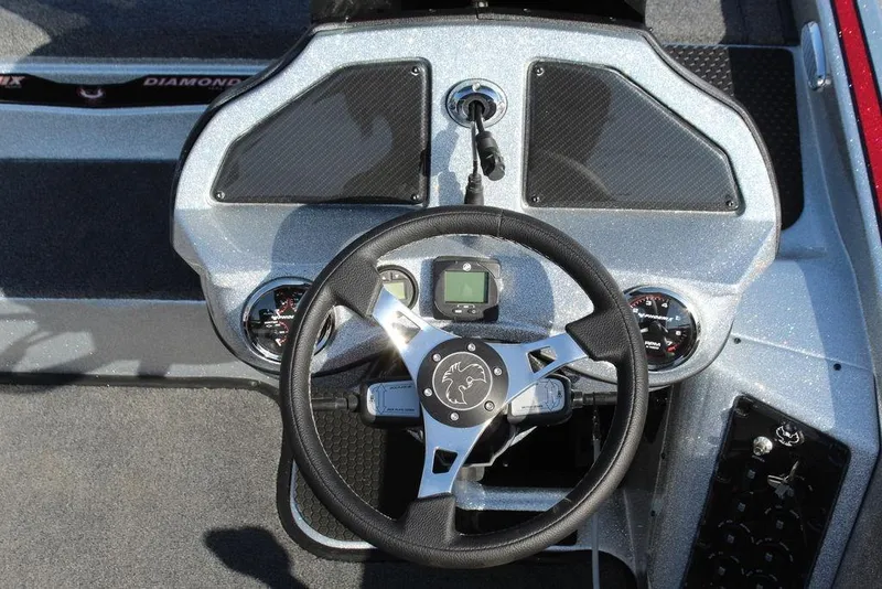 Slide: The Image of Steering console of 2026 Phoenix 921 Elite X boat with modern controls and gauges. - 5