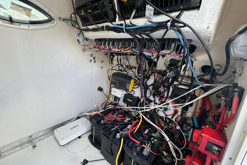 Slide: The Image of Electrical wiring and components inside a 2019 Twin Vee 26 Center Console boat. - 9