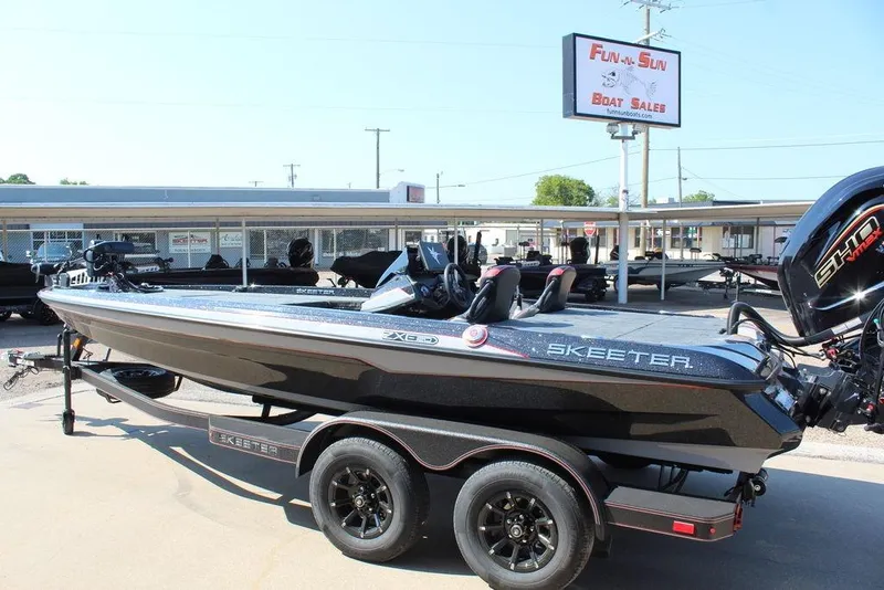 Slide: The Image of 2026 Skeeter ZXE20 boat at Fun-N-Sun Boat Sales dealership. - 11