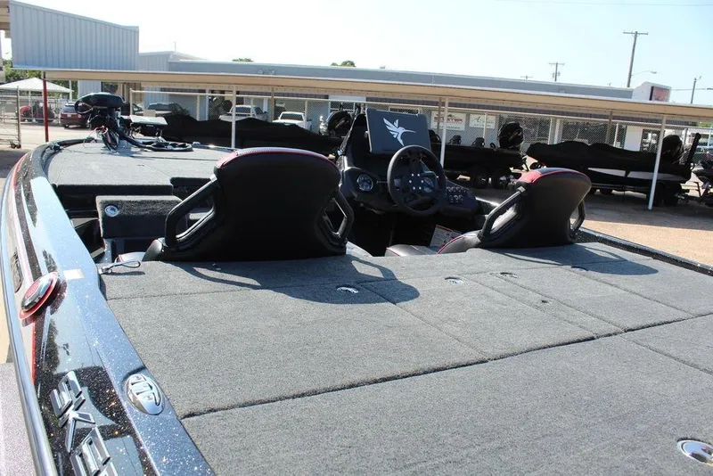 Slide: The Image of 2026 Skeeter ZXE20 boat interior with dual seats and steering console. - 13