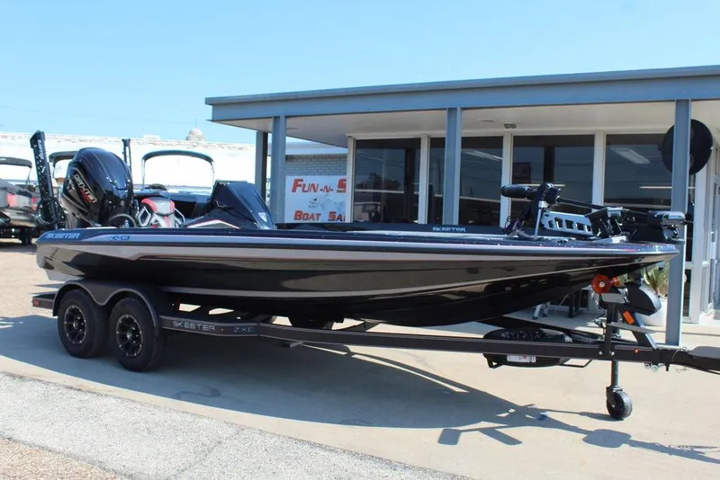 The Image of 2026 Skeeter ZXE20 boat on trailer at dealership, showcasing sleek design and modern features. - 2