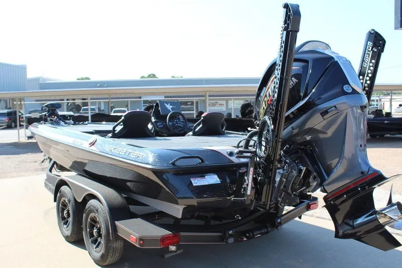 Slide: The Image of 2026 Skeeter ZXE20 boat on trailer, featuring powerful outboard motor. - 7