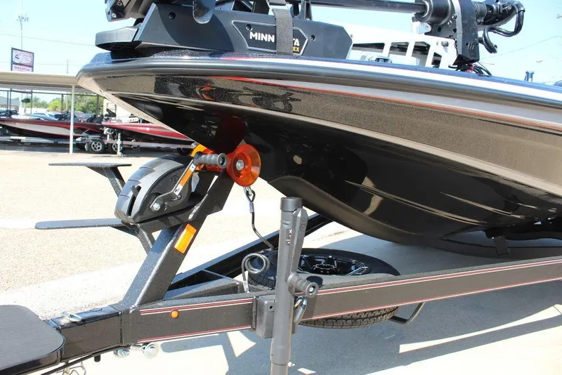 Slide: The Image of 2026 Skeeter ZXE20 boat on trailer, featuring Minn Kota trolling motor. - 8