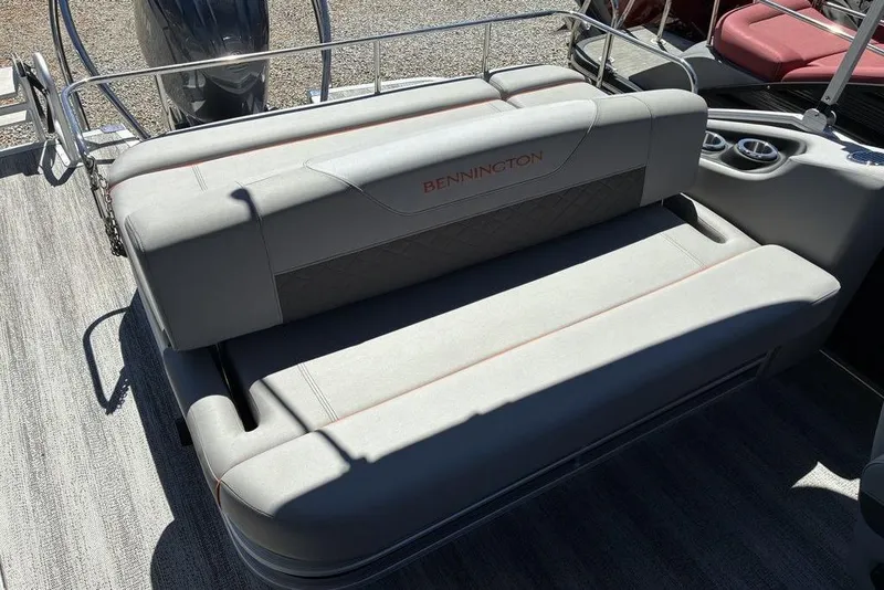 Slide: The Image of 2025 Bennington 22 SX Swingback boat seat with gray upholstery and cup holders. - 6