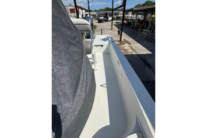 Slide: The Image of 2011 Ranger 2400 Bay Ranger boat interior view at a marina. - 11