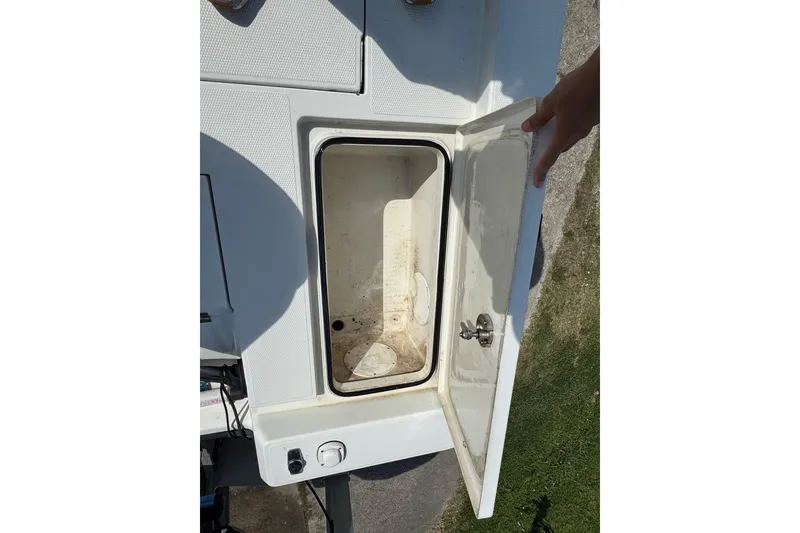Slide: The Image of Open storage compartment on a 2011 Ranger 2400 Bay Ranger boat. - 16