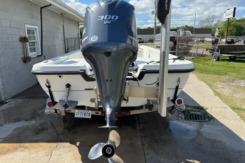 Slide: The Image of 2011 Ranger 2400 Bay Ranger boat with Yamaha 300 V6 engine, parked outdoors. - 4