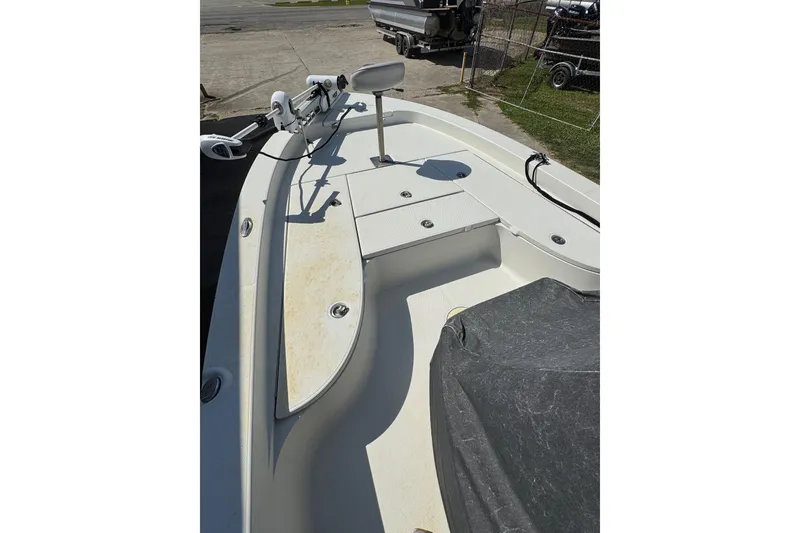 Slide: The Image of 2011 Ranger 2400 Bay Ranger boat deck with storage compartments and trolling motor. - 7