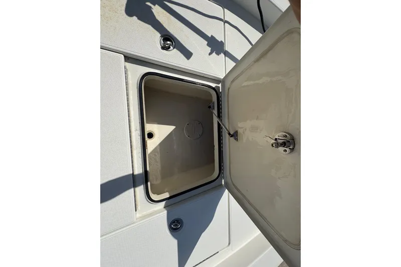 Slide: The Image of Open storage compartment on 2011 Ranger 2400 Bay Ranger boat deck. - 9