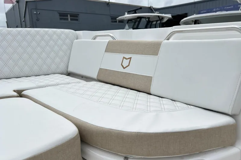 Slide: The Image of 2026 Sea Fox 268 Commander boat seating with diamond-stitched upholstery and logo detail. - 10