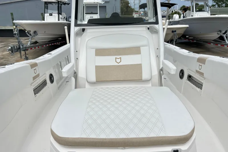 Slide: The Image of 2026 Sea Fox 268 Commander boat interior with beige and white seating. - 11