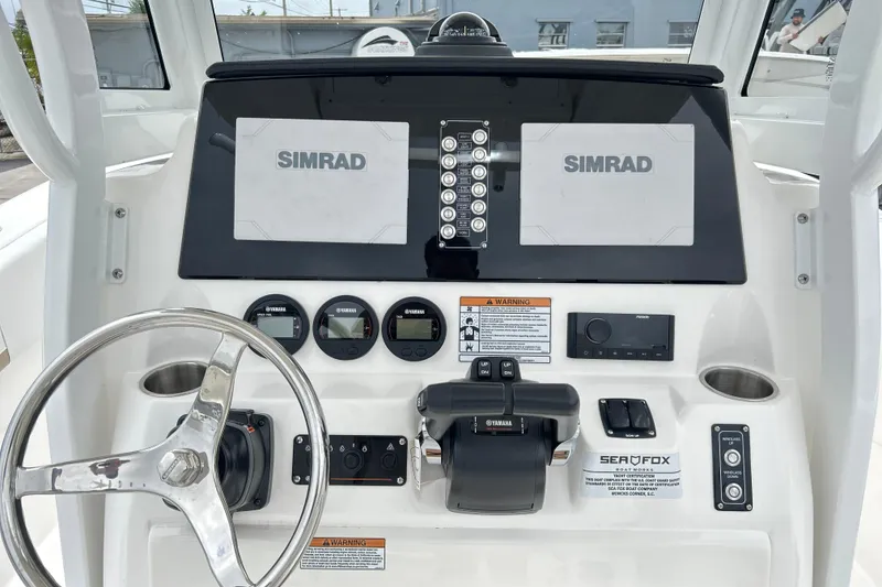 Slide: The Image of 2026 Sea Fox 268 Commander dashboard with Simrad displays and Yamaha controls. - 19