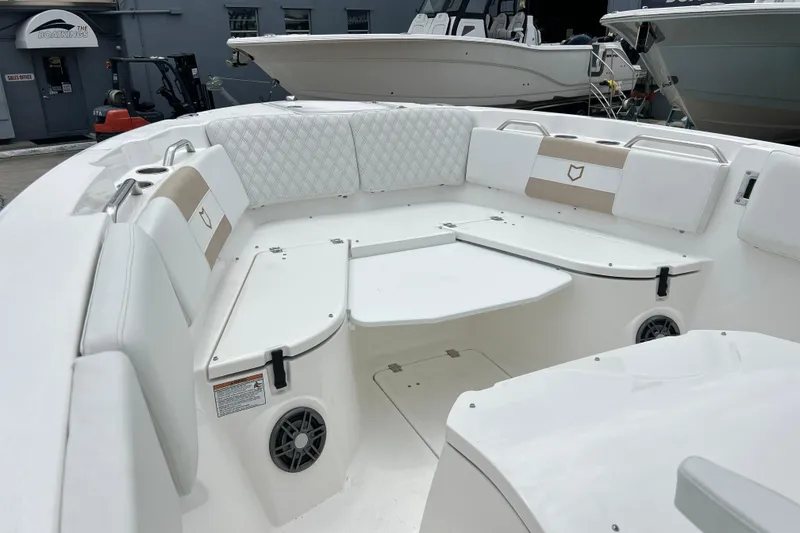 Slide: The Image of 2026 Sea Fox 268 Commander boat interior with white seating and modern design. - 2