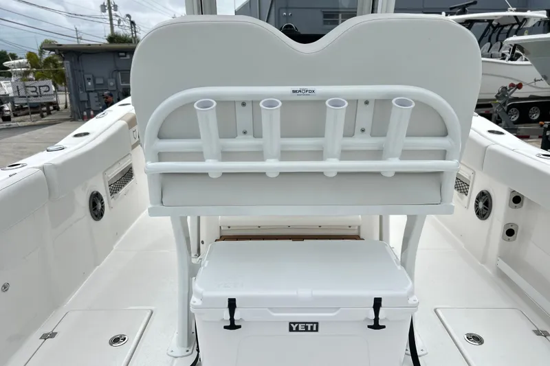 Slide: The Image of 2026 Sea Fox 268 Commander boat interior with rod holders and Yeti cooler. - 22