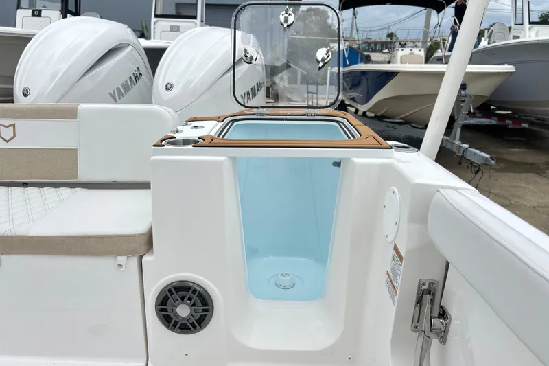 Slide: The Image of 2026 Sea Fox 268 Commander boat interior with open storage compartment and Yamaha engines. - 25