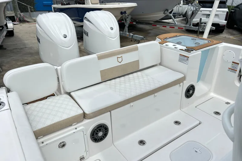Slide: The Image of 2026 Sea Fox 268 Commander boat interior with cushioned seating and Yamaha engines. - 29