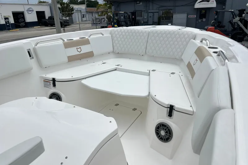 Slide: The Image of 2026 Sea Fox 268 Commander boat interior with cushioned seating and built-in speakers. - 3