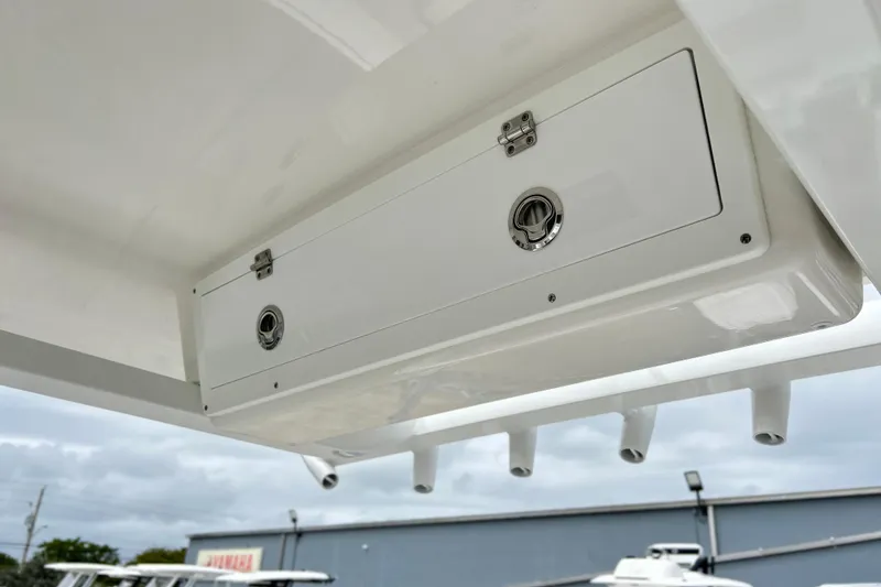 Slide: The Image of Storage compartment on 2026 Sea Fox 268 Commander boat, featuring secure latches and sleek design. - 37