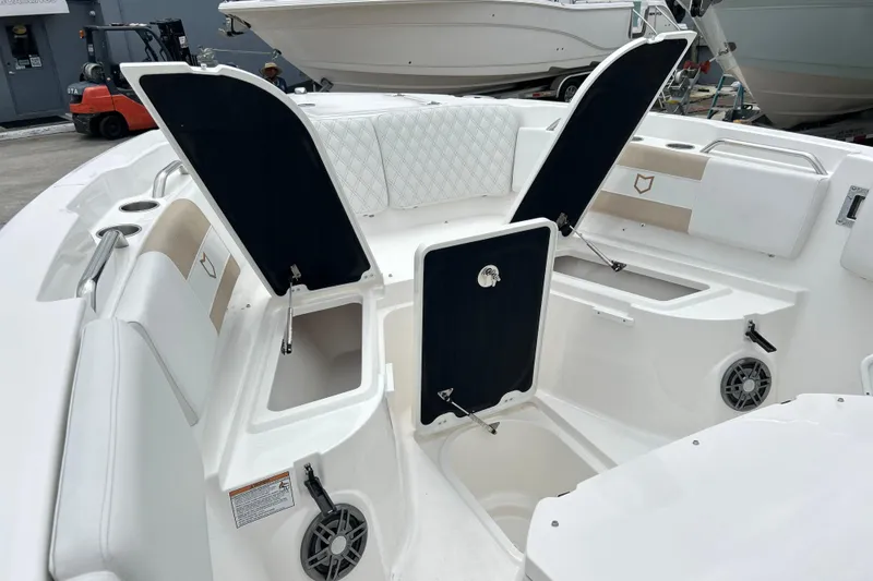 Slide: The Image of 2026 Sea Fox 268 Commander boat interior with open storage compartments and seating. - 4