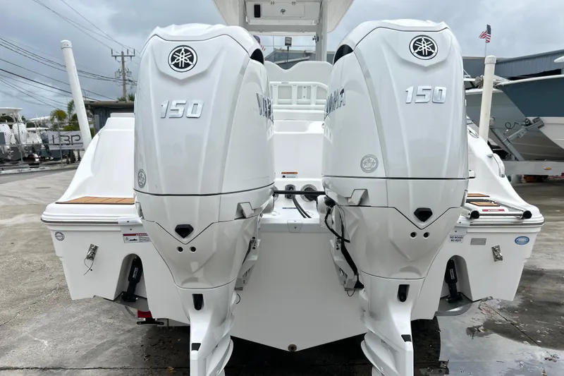 Slide: The Image of 2026 Sea Fox 268 Commander with twin Yamaha 150 outboard engines, docked outdoors. - 46