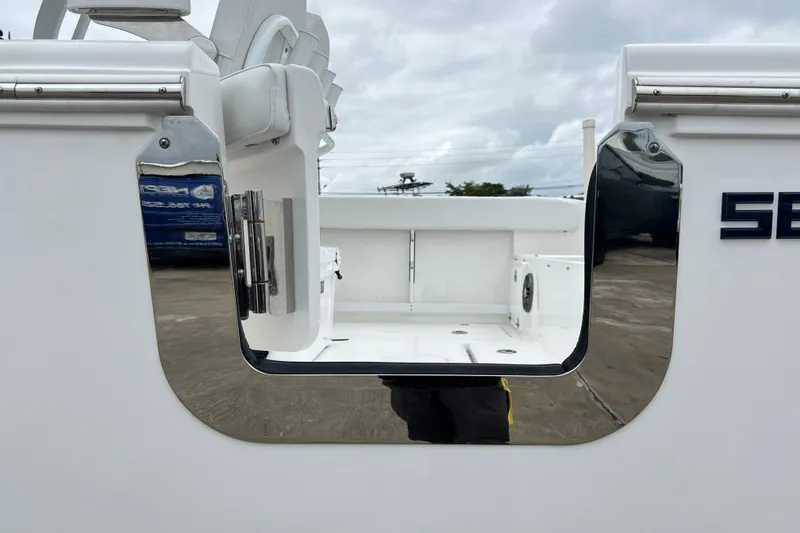 Slide: The Image of 2026 Sea Fox 268 Commander boat with open side door, showcasing sleek design. - 48