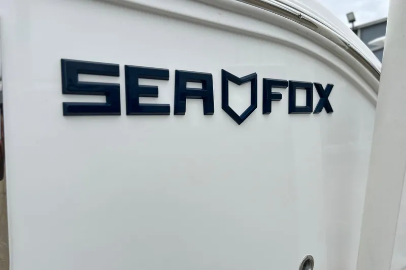 Slide: The Image of Sea Fox 268 Commander 2026 logo on white boat surface. - 50