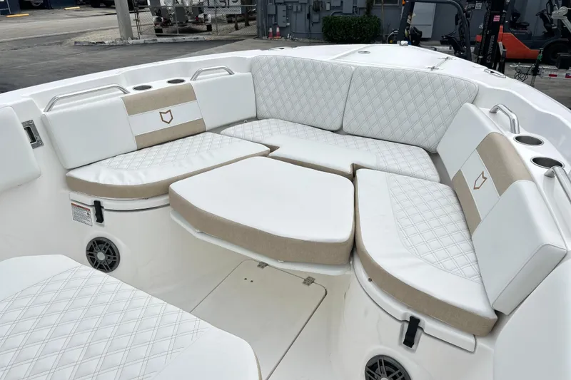 Slide: The Image of Luxurious seating area on a 2026 Sea Fox 268 Commander boat, featuring white and beige cushions. - 7