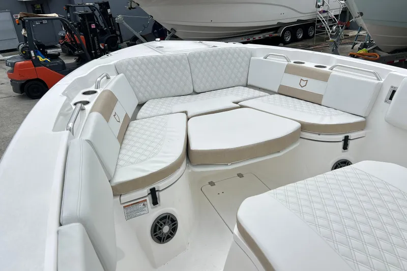 Slide: The Image of 2026 Sea Fox 268 Commander boat interior with cushioned seating and cup holders. - 8