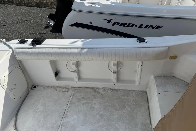 Slide: The Image of 2000 Sport-Craft 241 Walk Around boat interior with Pro-Line branding visible. - 10