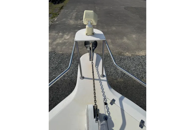 Slide: The Image of Bow view of a 2000 Sport-Craft 241 Walk Around boat with anchor chain. - 5