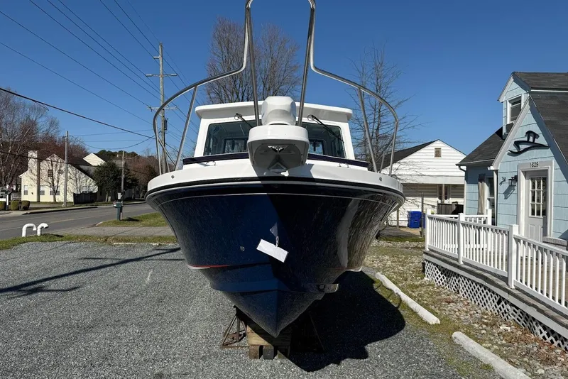 Slide: The Image of Steiger Craft 28 Annapolis 2026 boat on a parking lot. - 3