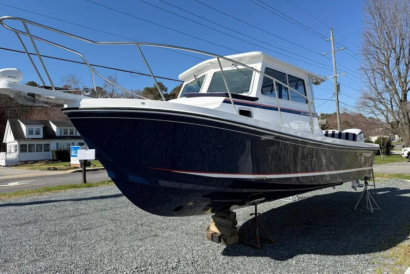 Slide: The Image of Steiger Craft 28 Annapolis 2026 displayed on a gravel lot. - 4