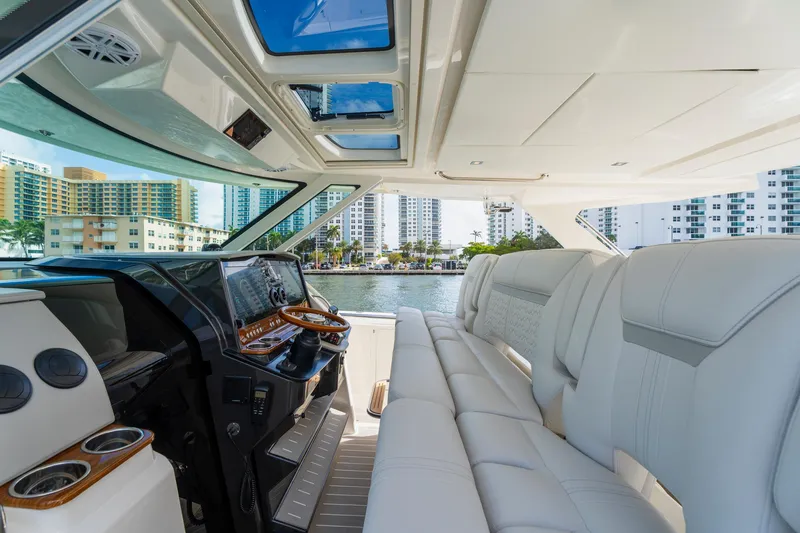 Slide: The Image of Luxurious interior of 2024 Tiara Yachts 43 LS with plush seating and modern helm. - 27