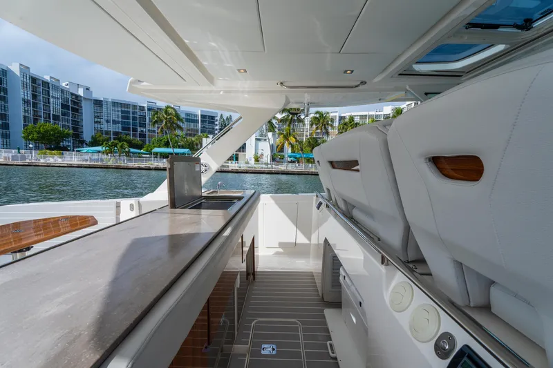 Slide: The Image of 2024 Tiara Yachts 43 LS luxury yacht interior with sleek design and waterfront view. - 31