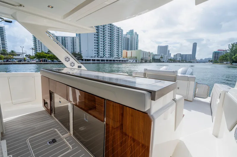 Slide: The Image of 2024 Tiara Yachts 43 LS luxury yacht interior with city skyline view. - 34