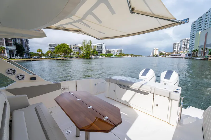 Slide: The Image of 2024 Tiara Yachts 43 LS luxury yacht interior with waterfront city view. - 35