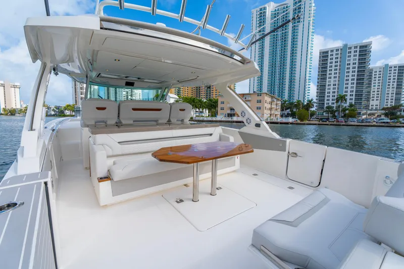 Slide: The Image of 2024 Tiara Yachts 43 LS luxury yacht interior with city skyline backdrop. - 36