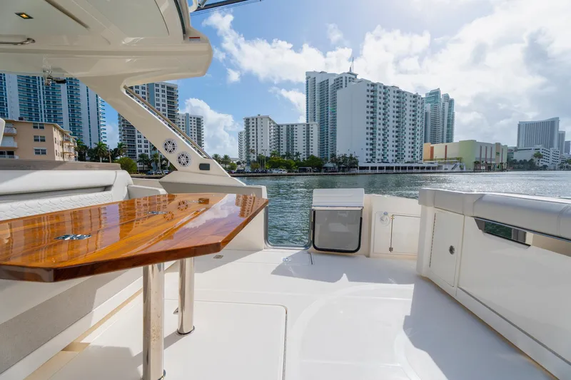 Slide: The Image of Luxurious 2024 Tiara Yachts 43 LS with elegant deck and city skyline view. - 37