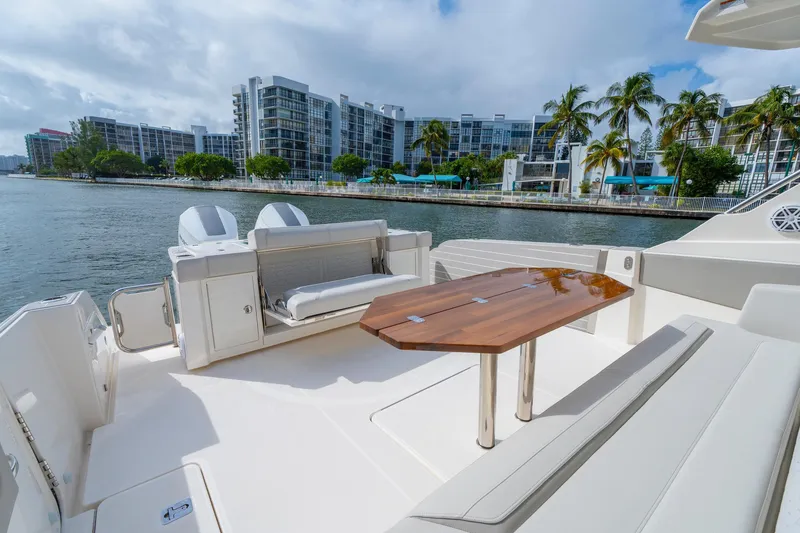 Slide: The Image of 2024 Tiara Yachts 43 LS luxury yacht with elegant seating and waterfront view. - 39