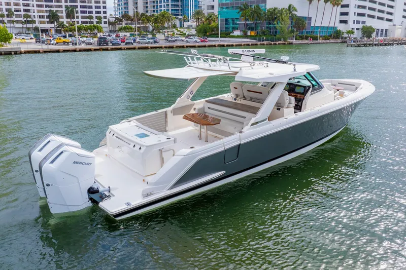 Slide: The Image of 2024 Tiara Yachts 43 LS luxury boat on water, featuring sleek design and powerful engines. - 4