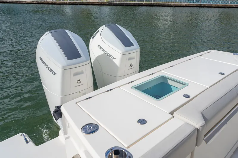 Slide: The Image of 2024 Tiara Yachts 43 LS with dual Mercury outboard engines on water. - 45