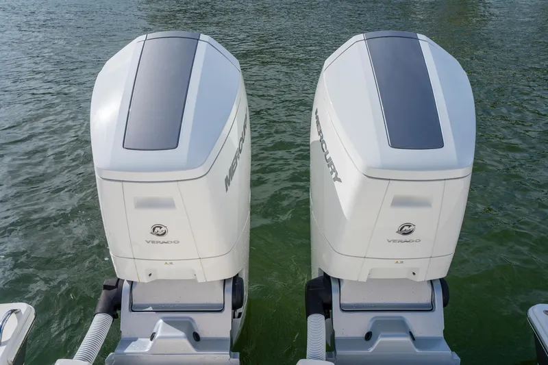 Slide: The Image of Twin Mercury Verado outboard engines on 2024 Tiara Yachts 43 LS, cruising on water. - 48