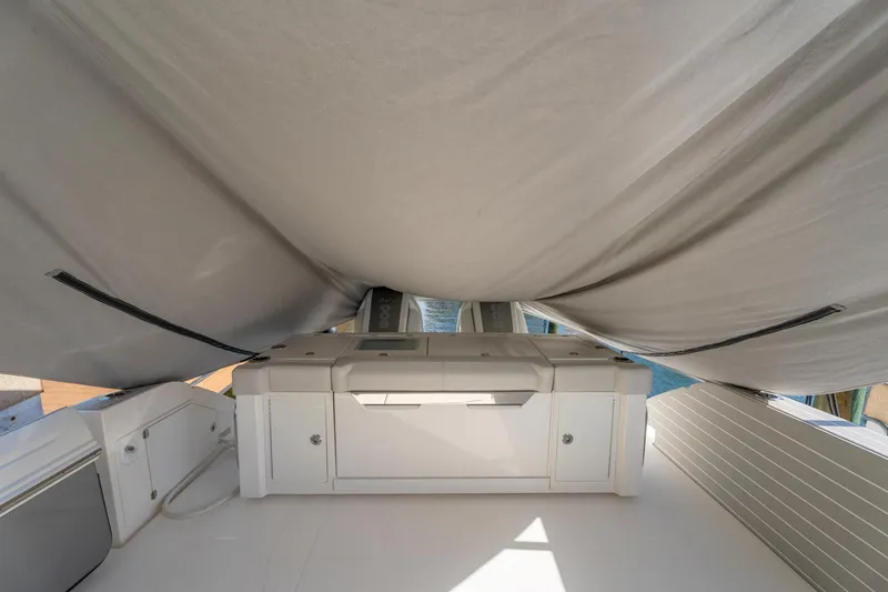Slide: The Image of 2024 Tiara Yachts 43 LS interior with covered deck and storage compartments. - 54