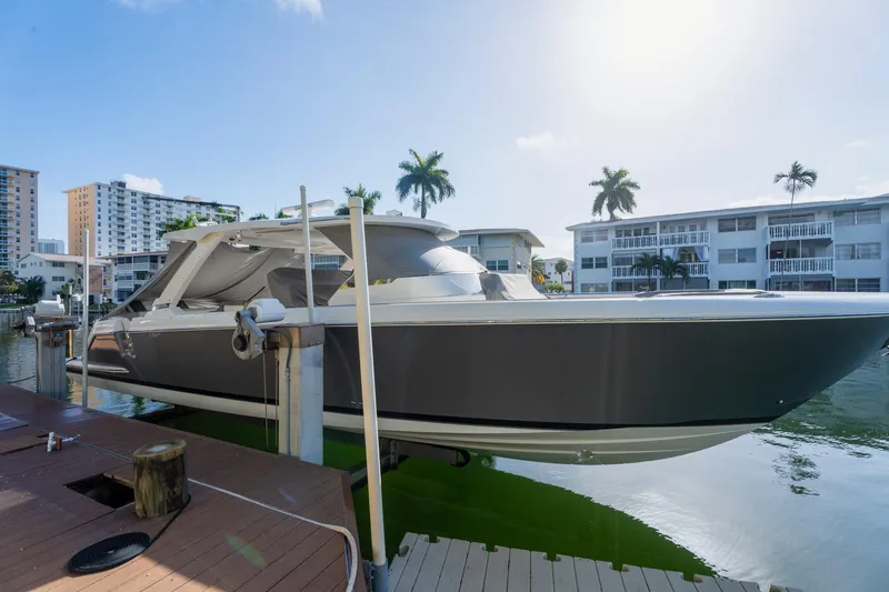 Slide: The Image of 2024 Tiara Yachts 43 LS docked, showcasing sleek design and modern architecture. - 55