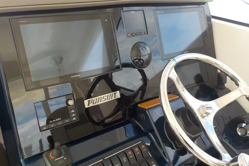 Slide: The Image of 2020 Pursuit OS 355 Offshore helm with Garmin displays and JL Audio system. - 5